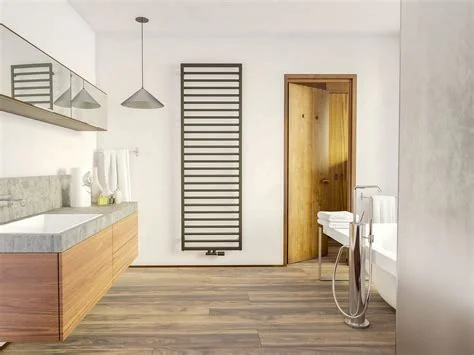 Modern heated towel radiator in stylish contemporary bathroom